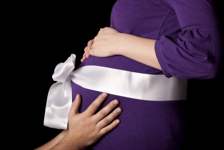 Pregnant woman is awaiting her little baby.の写真素材