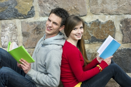 Young students are reading books together.の写真素材