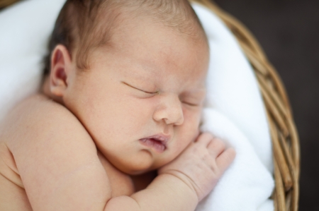 Little newborn girl is sleeping.の写真素材