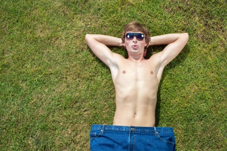 slim handsome guy in big jeansの写真素材