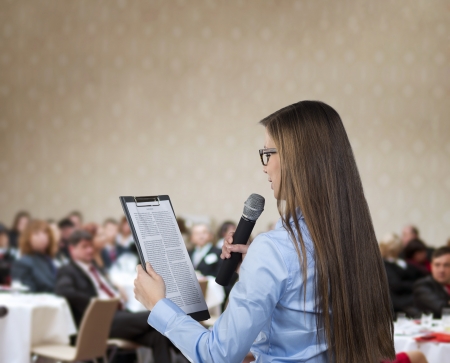 Beautiful business woman is speaking on conference.の写真素材