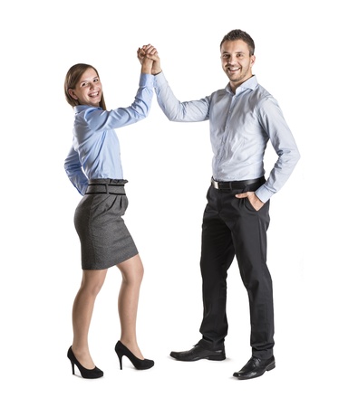Successful business couple is standing on isolated background.の写真素材