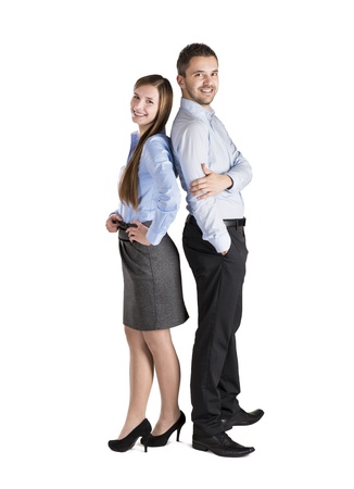 Successful business couple is standing on isolated background.の写真素材