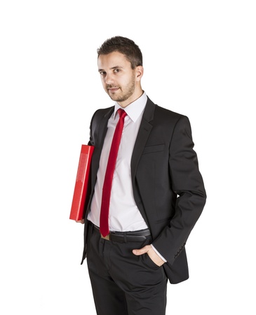 Successful business man is standing on isolated white backgroundの写真素材