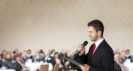 Man is speaking on indoor business conference for managers の写真素材