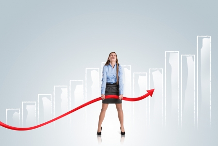Business woman is trying to increase market statistics.の写真素材