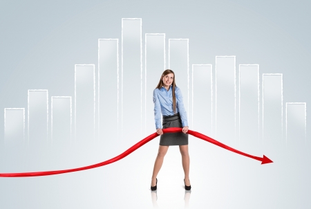 Business woman is trying to increase market statistics.の写真素材