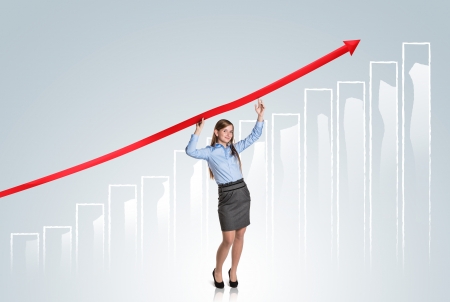 Business woman is trying to increase market statistics.の写真素材