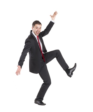 Happy business manager is standing on isolated white backgroundの写真素材