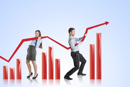 Business woman is trying to increase market statistics の写真素材