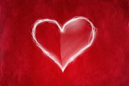 Love concept with heart on red abstract background の写真素材