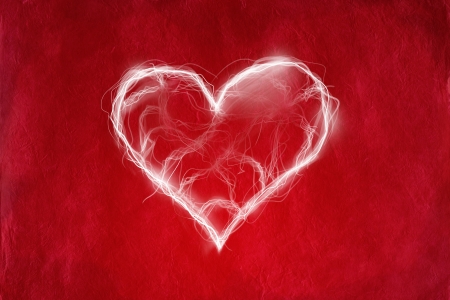 Love concept with heart on red abstract background の写真素材