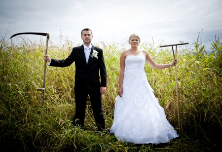Bride and groom are posing outdoorsの写真素材