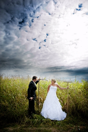 Bride and groom are posing outdoorsの写真素材