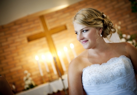 Bride and groom in the church at the wedding dayの写真素材