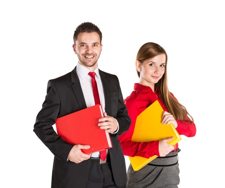 Successful business couple is standing on isolated background.の写真素材