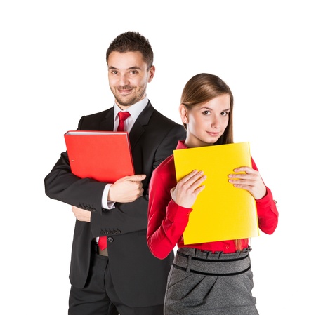 Successful business couple is standing on isolated background.の写真素材