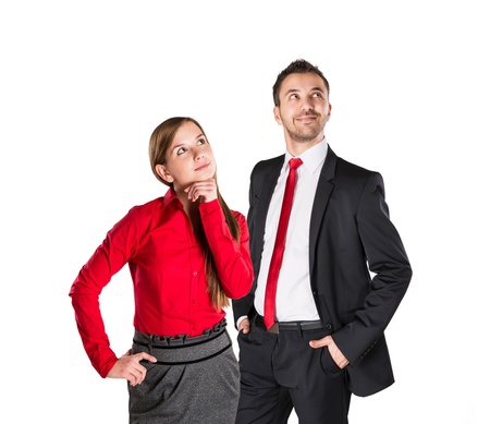 Successful business couple is standing on isolated background.の写真素材