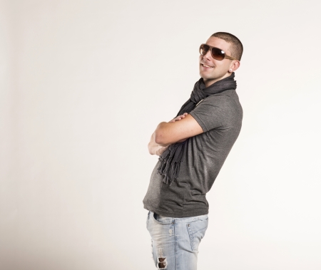 Stylish young man posing isolated on white background.の写真素材