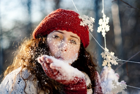 A beautiful outdoor pregnant woman portrait in snowy nature の写真素材