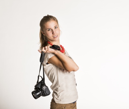 Young photographer with camera isolated on white backgroundの写真素材