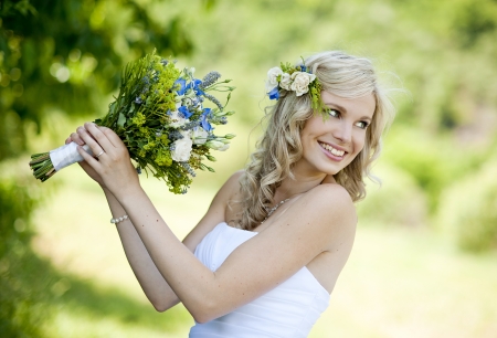 Beautiful bride is enjoying her wedding dayの写真素材