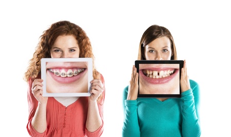 Funny studio portraits with tablet on isolated background
