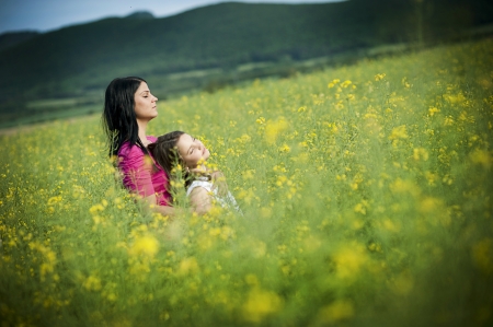 Mother and daughter are together in the park
