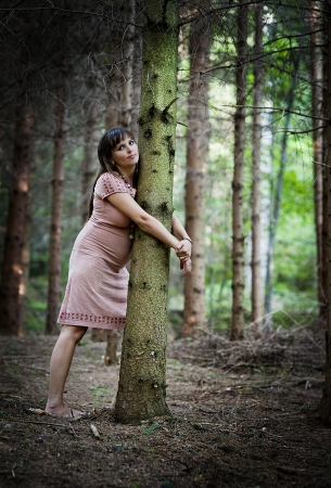 Portrait of young pregnant woman in natureの写真素材