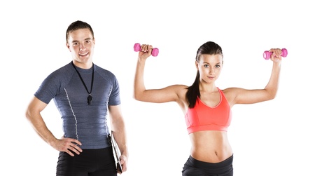 Professional fitness coach with beautiful young woman on white backgroundの写真素材