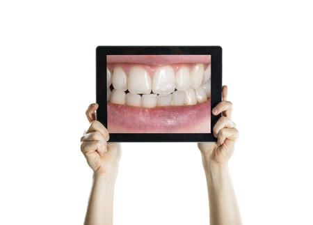 Dental closeup with tablet screen, isolated on white