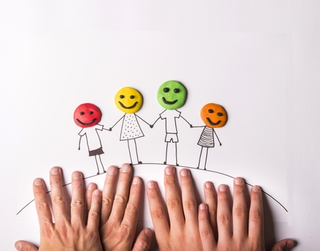 Happy family concept with heads from play doughの写真素材