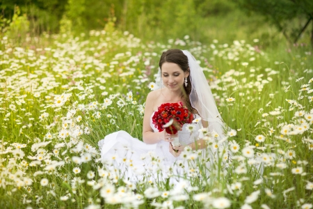 Bride in white wedding dress at the meadowの写真素材