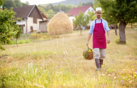 Young male gardener working in the gardenの写真素材