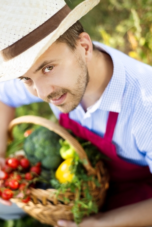 Young male gardener working in the gardenの写真素材