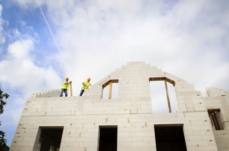 Construction Contractors building a big new homeの写真素材