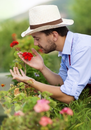 Young male gardener working in the gardenの写真素材