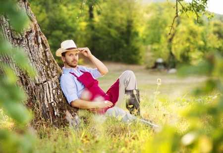 Young male gardener working in the gardenの写真素材