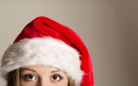 Beautiful smiling woman opening her christmas giftの写真素材