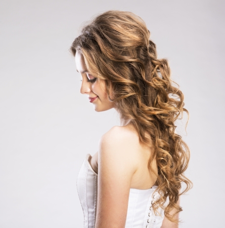 Studio portraits with beautiful woman isolated on gray backgroundの写真素材