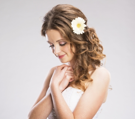 Studio portraits with beautiful bride isolated on gray backgroundの写真素材