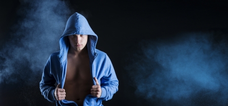 Young fitness fashion model is posing in studio on black background の写真素材