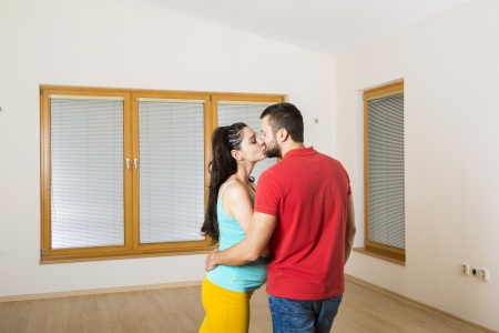 Pregnant mother and handsome father are going to move in to new house  Happy couple の写真素材