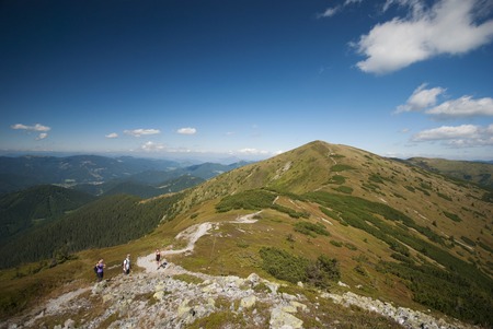 Hikers on the top of mountainsの写真素材