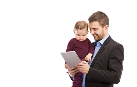 Man with his baby is working  Manager is using digital tablet の写真素材