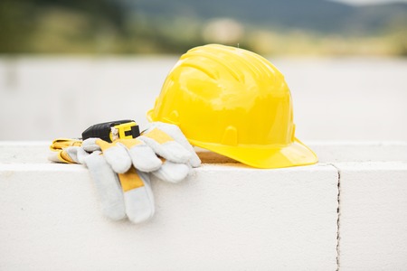 Image of engineer workplace with blueprint, hardhat and measuring toolsの写真素材