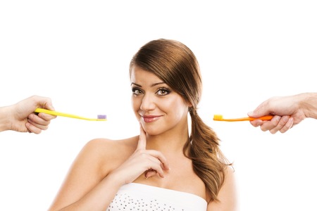 Beautiful woman with toothbrush  Dental care portrait  Isolated on white background の写真素材