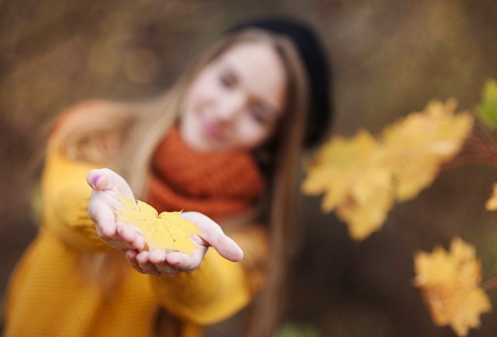 Outdoor portrait of beautiful girl in autumn forestの写真素材