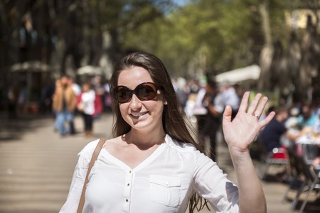 Pretty young female tourist is enjoying vacation in Barcelona city, Spain 