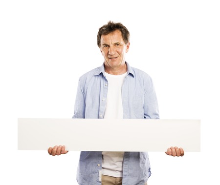 Portrait of happy senior man with blank advertising board or copy space, isolated on whiteの写真素材